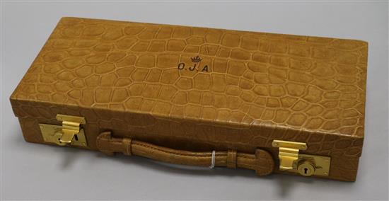 A crocodile skin jewellery case, early 20th century, 37.5 x 16.5cm x 7cm